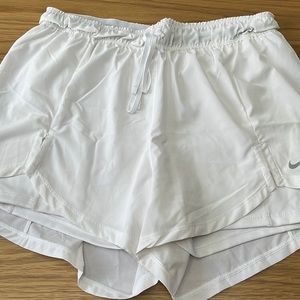 White Nike shorts with spandex liner